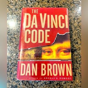 The Da Vinci Code by Dan Brown hardcover book.